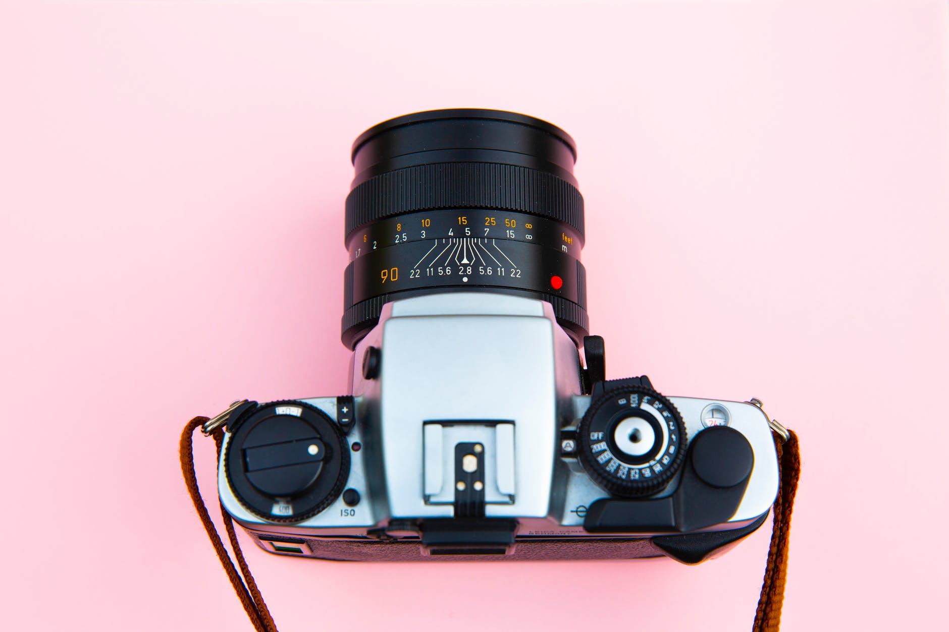 black and silver camera on brown wooden table